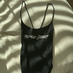 Black body suit, worn once, snaps at the bottom